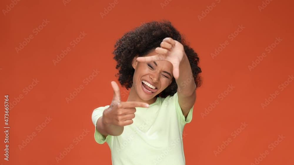 Trendy lady make photo hands tongue out isolated scarlet color background Trendy lady make photo hands tongue out isolated scarlet color background