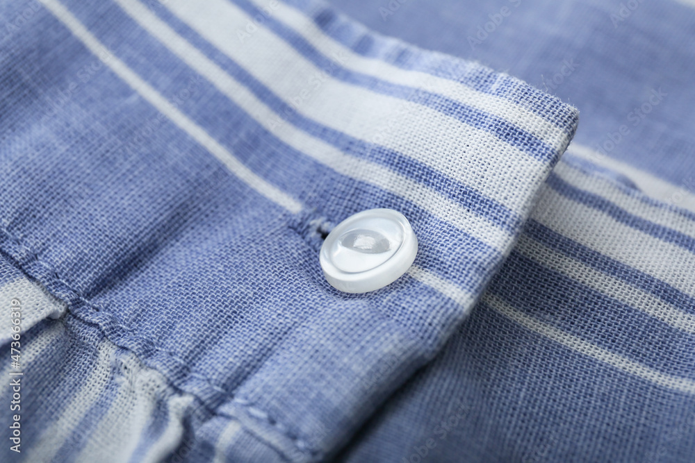 Button on stylish color shirt, closeup Button on stylish color shirt, closeup