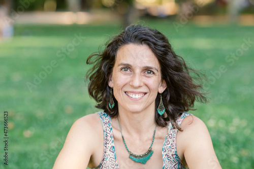 Chic mature woman in forties portrait at park photo