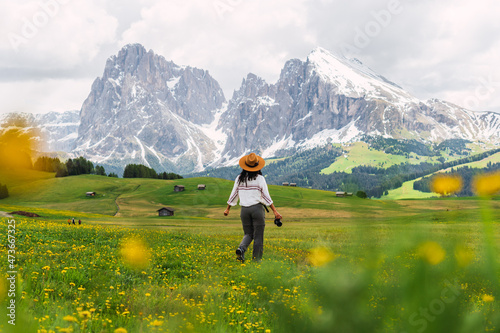 Young girl alone in Dolomites. photo