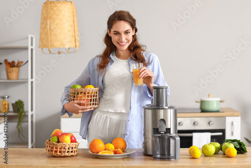 Young woman with glass of f...