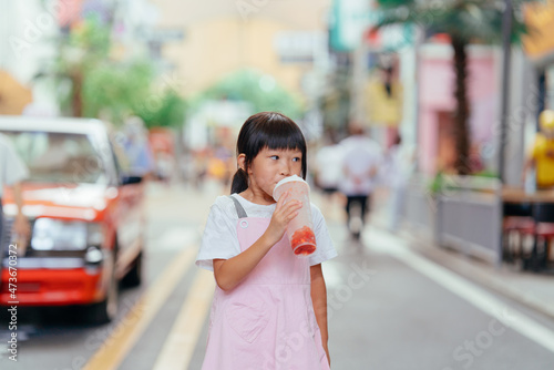 little girl drinks juice