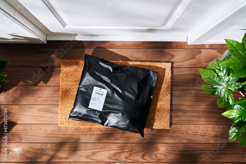 Parcel in plastic bag near door