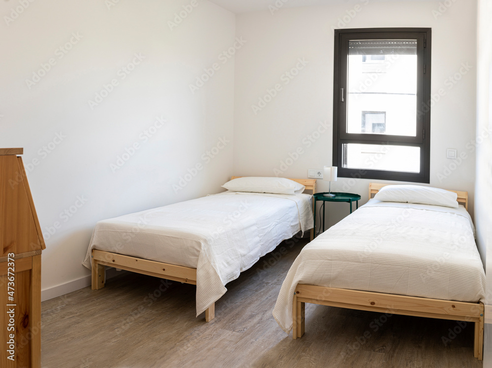 Minimalist dorm room with two beds Minimalist dorm room with two beds