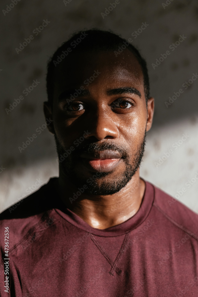 African American sportsman looking at camera African American sportsman looking at camera