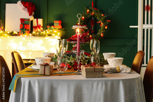 Fotografie, Obraz Dining table with beautiful setting in living room decorated for Christmas eve
