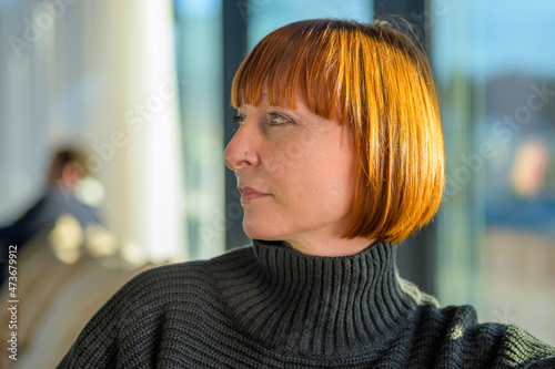 Portrait of an attractive middle-aged red haired woman