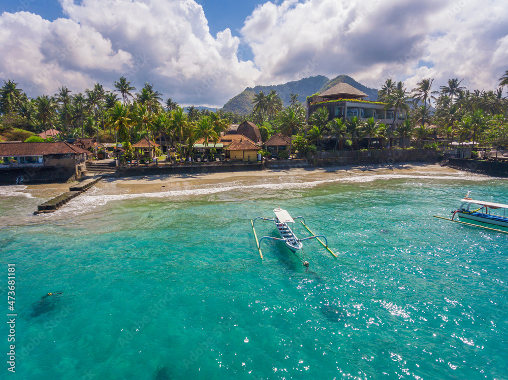 An aerial panoramic view on Candi Dasa shoreline on Bali island in Indonesia