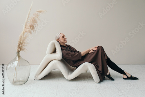 Sustainable Fashion - Elegant senior woman portrait photo