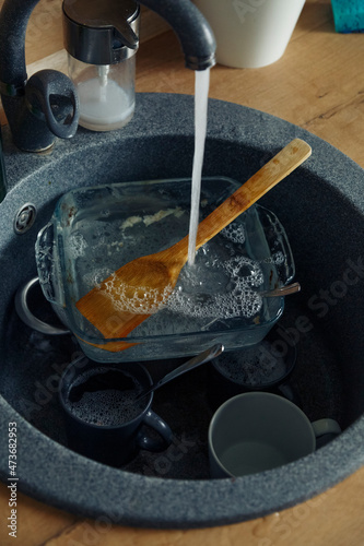 Kitchenware soaking in sink