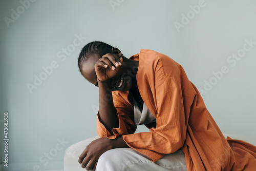 Black woman laughing - Authentic emotional portrait photo