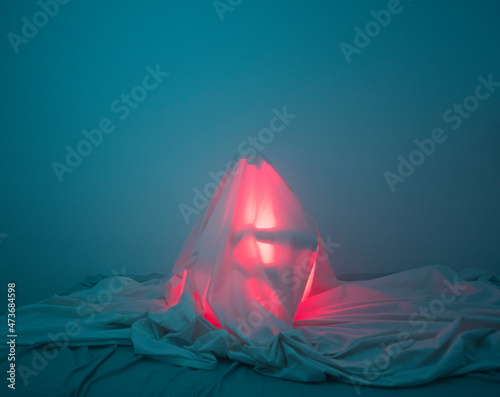 Mysterious person under the sheets