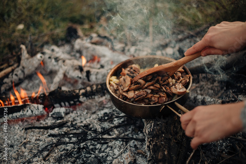 Wallpaper Mural cooking outdoors, frying mushrooms on the skillet pan Torontodigital.ca