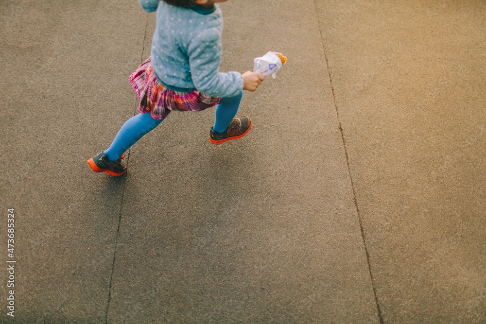 Little girl running with icecream Stock Photo Adobe Stock