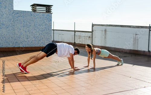 Young couple training outdoors
