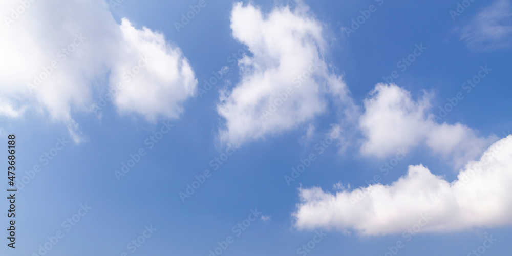 Blue sky with white cumulus clouds on a daytime