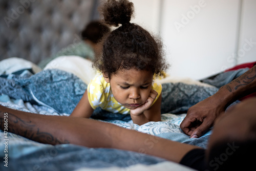 Toddler making angry face photo