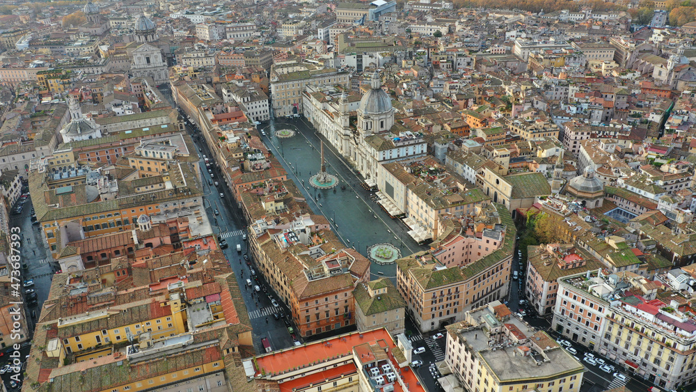 Aerial drone photo of famous elliptical Piazza Navona an elegant square dating from the 1st century A.D., with a classical fountain, street artists and bars a true tourist attraction, Rome, Italy Aerial drone photo of famous elliptical Piazza Navona an elegant square dating from the 1st century A.D., with a classical fountain, street artists and bars a true tourist attraction, Rome, Italy