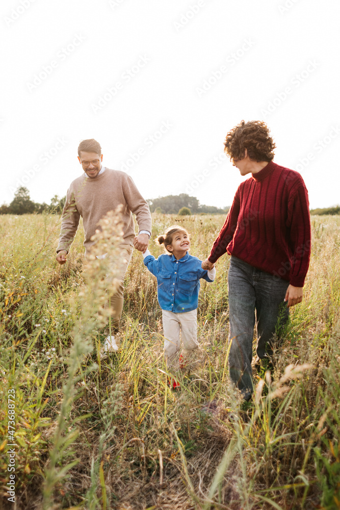 Little Girl with Parents in Nature Little Girl with Parents in Nature