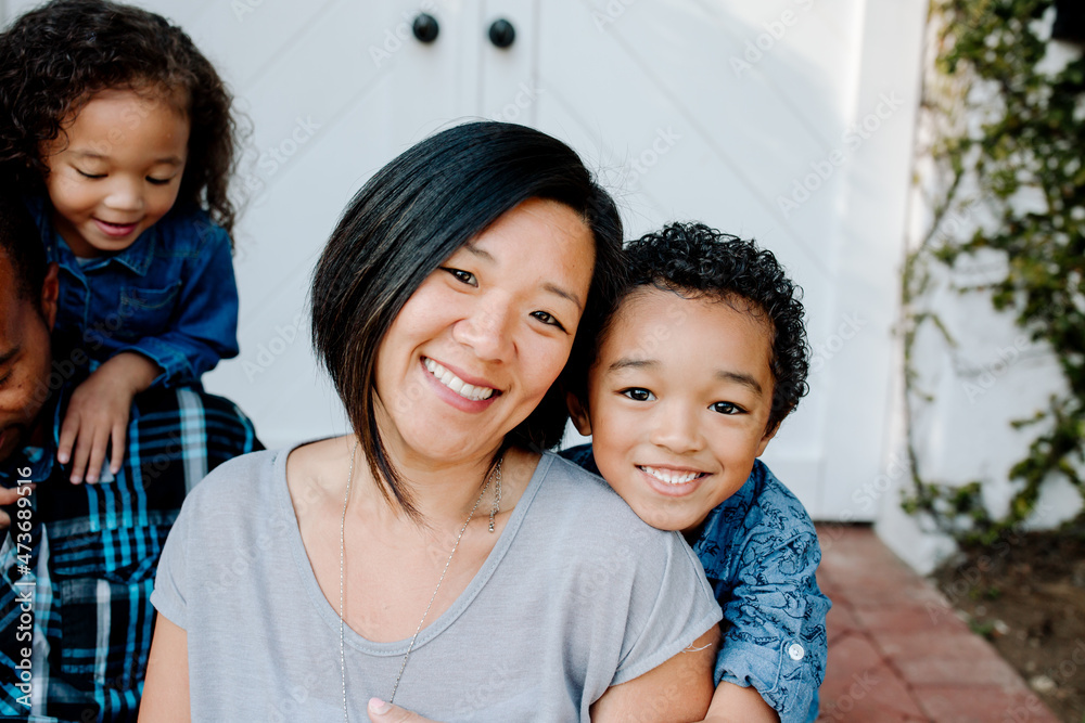 Smiling Asian mom with mixed race son Smiling Asian mom with mixed race son