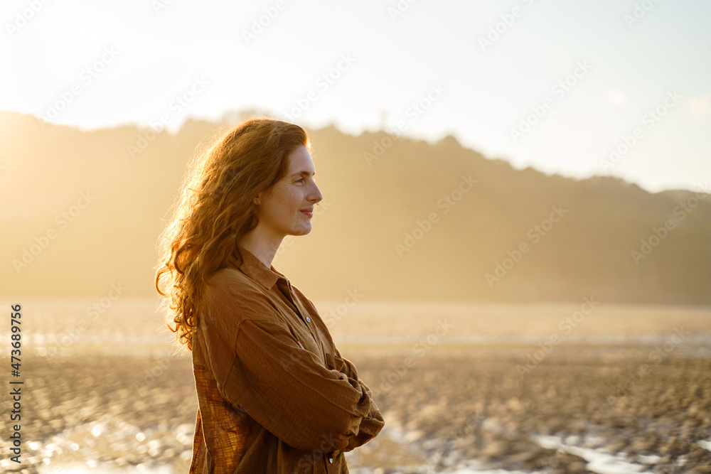 Portrait of serene woman enjoying sunset Portrait of serene woman enjoying sunset