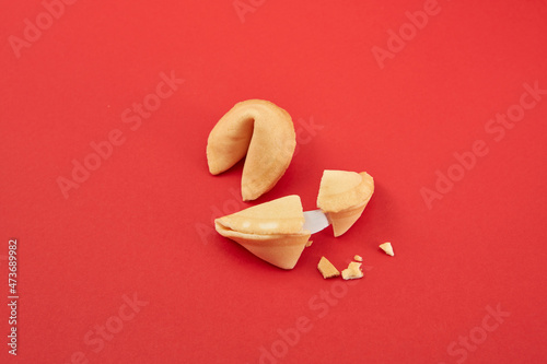 Broken and whole Chinese fortune cookies photo