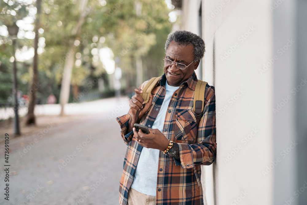 Aged man using cellphone Aged man using cellphone