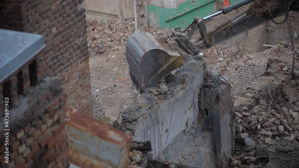 Destruction of ancient historical buildings, excavator breaks down an old vintage house. construction of new buildings on the site of abandoned housing concept. Urban Renewal 4k High quality video