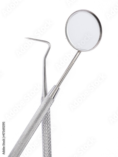 Dental mirror instrument on white background.