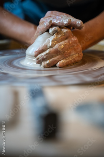 Centering clay on pottery wheel