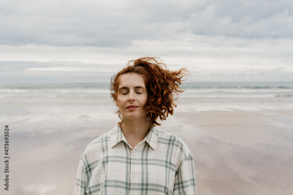 Portrait of calm woman in empty beach Portrait of calm woman in empty beach