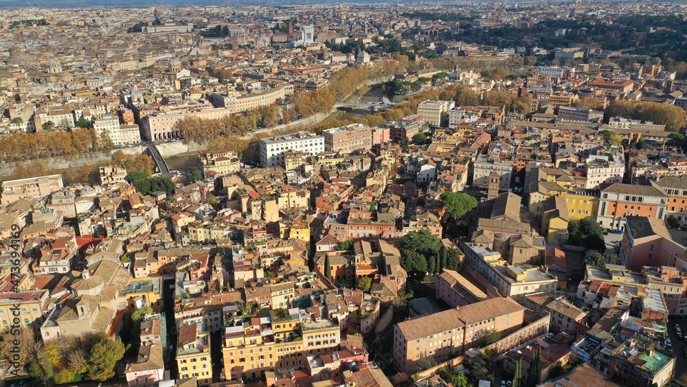 Aerial drone flight over famous Rome district of Trastevere with beautiful Roman architecture, Italy