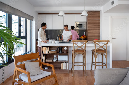 Content family cooking together in kitchen