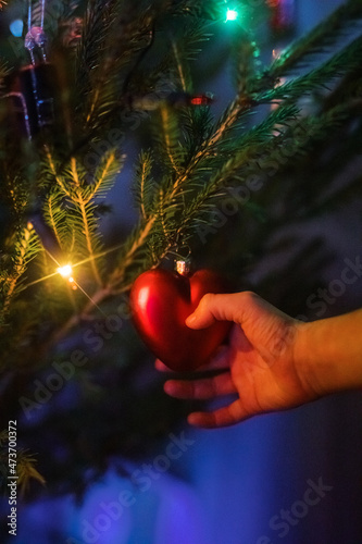 Kids next to a Christmas tree photo