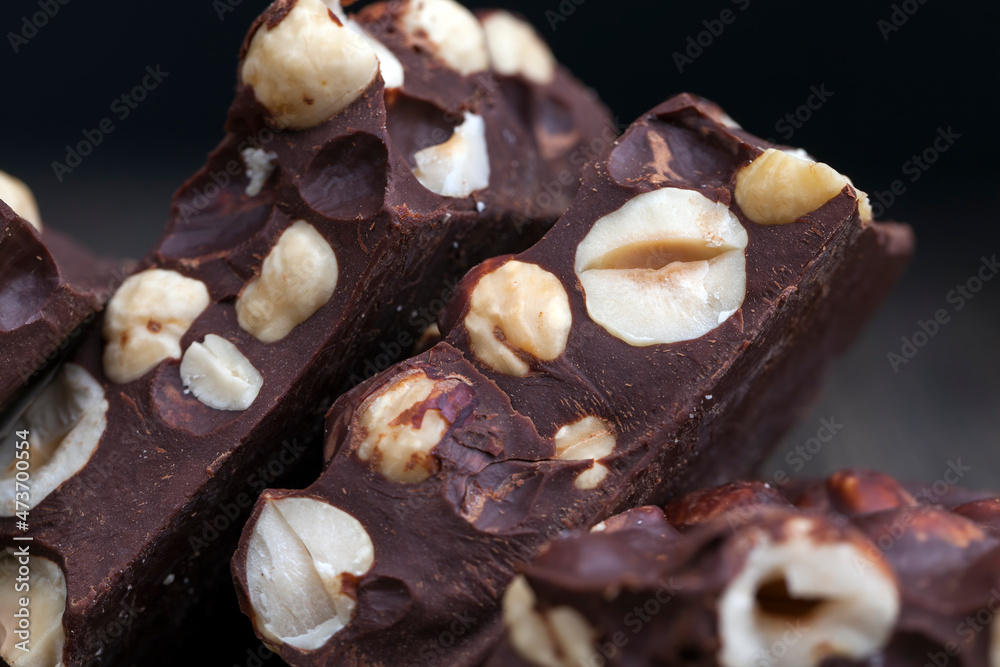 milk chocolate with whole and chunks of hazelnuts milk chocolate with whole and chunks of hazelnuts