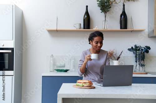 Young african american woman reading the morning news