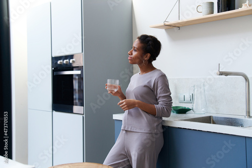 Black Lady Holding Glass With Water,
