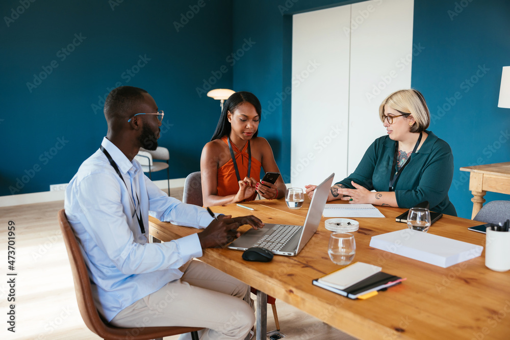 Diverse colleagues sitting at table Diverse colleagues sitting at table
