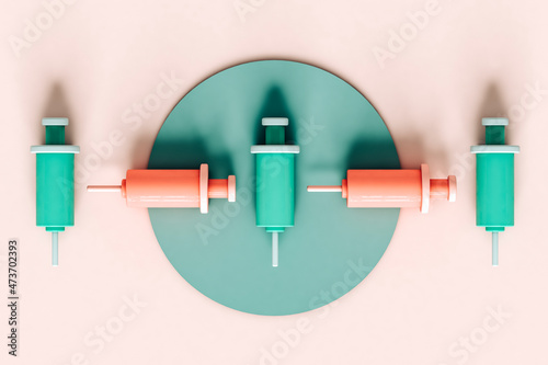 overhead view of cartoon 3d syringes on pastel pink photo
