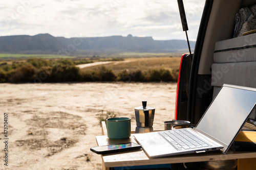 Working space in the back of a van outdoors in desert

