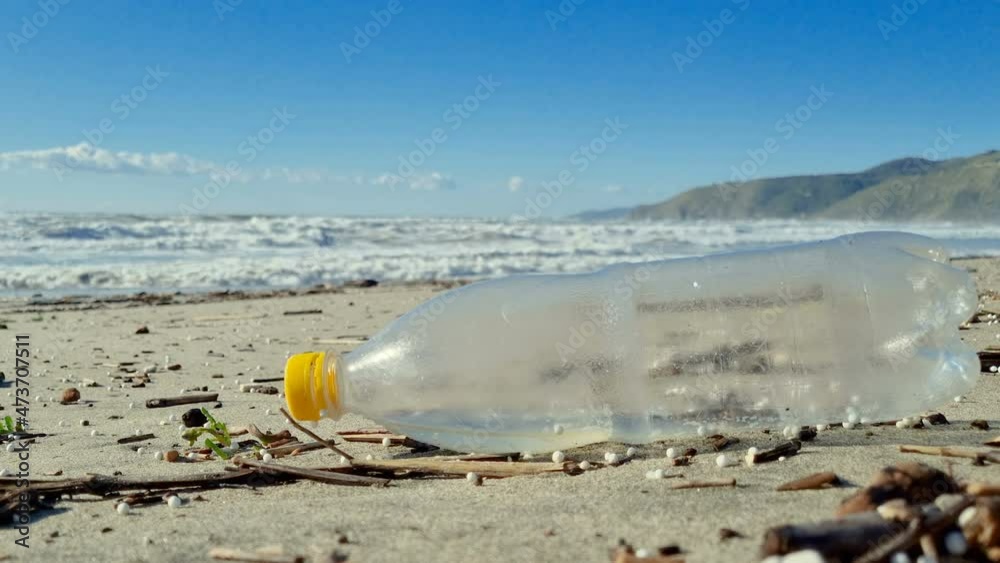 Plastic bottle discarded on pollution contaminated ocean sea coast habitat,environmental nature waste Plastic bottle discarded on pollution contaminated ocean sea coast habitat,environmental nature waste
