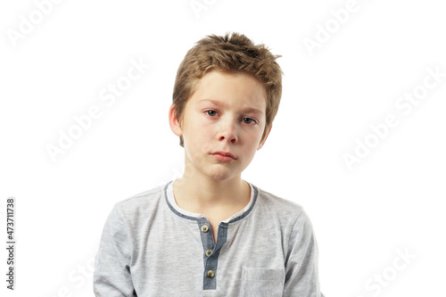 portrait of a sad boy isolated on white background.