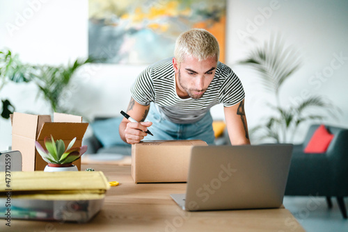 Seller checking address on laptop