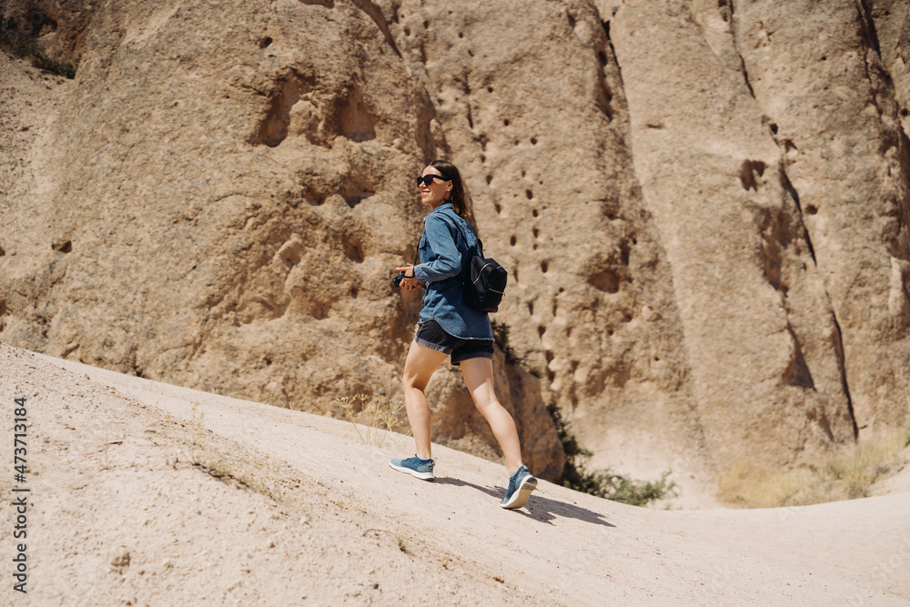 Wanderlust and travel concept. Women traveler on top of mountains, amazing view. Casual woman hiking. Atmospheric moment Wanderlust and travel concept. Women traveler on top of mountains, amazing view. Casual woman hiking. Atmospheric moment
