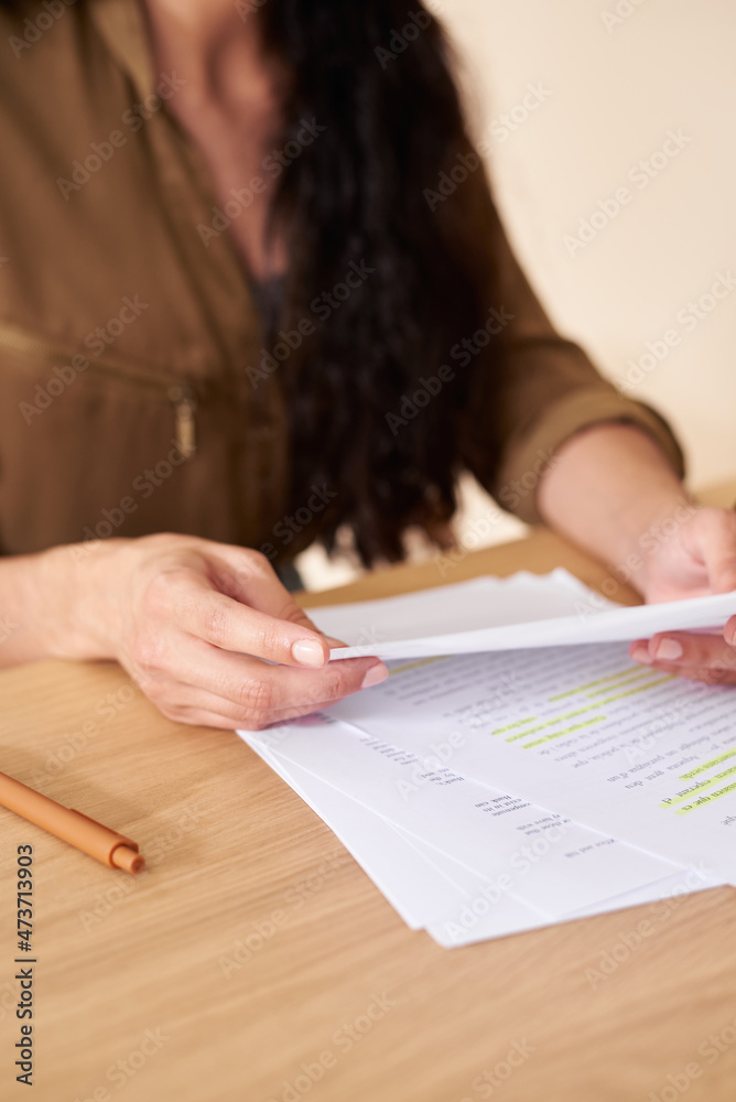 Woman with notes for recording podcast Woman with notes for recording podcast