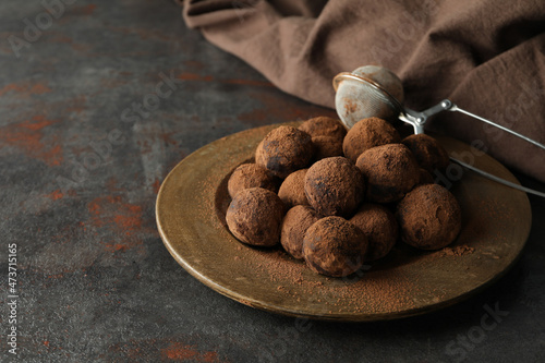 Concept of sweets with truffles on dark textured background