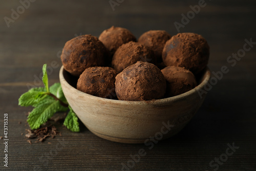 Concept of sweets with truffles on dark wooden background