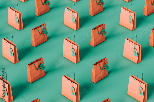pattern of paper bags on green . holiday sale concept photo
