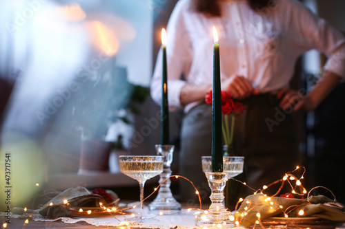 Photography Lifestyle trendy Christmas table setting with blurred woman on background