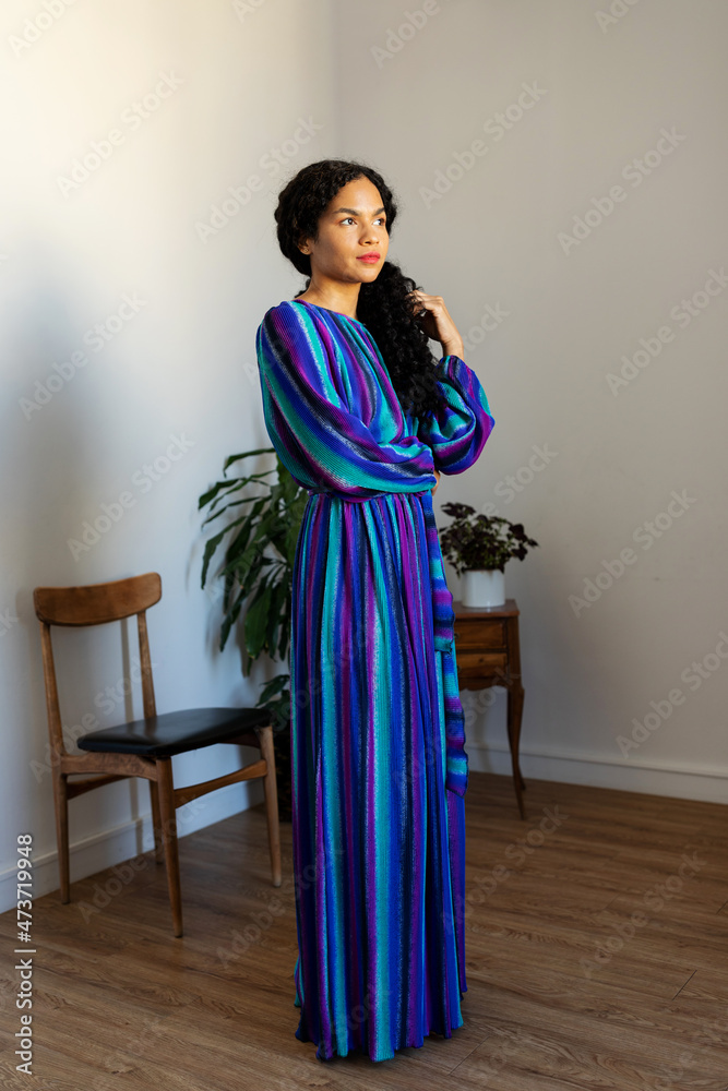 Female wearing striped dress Female wearing striped dress